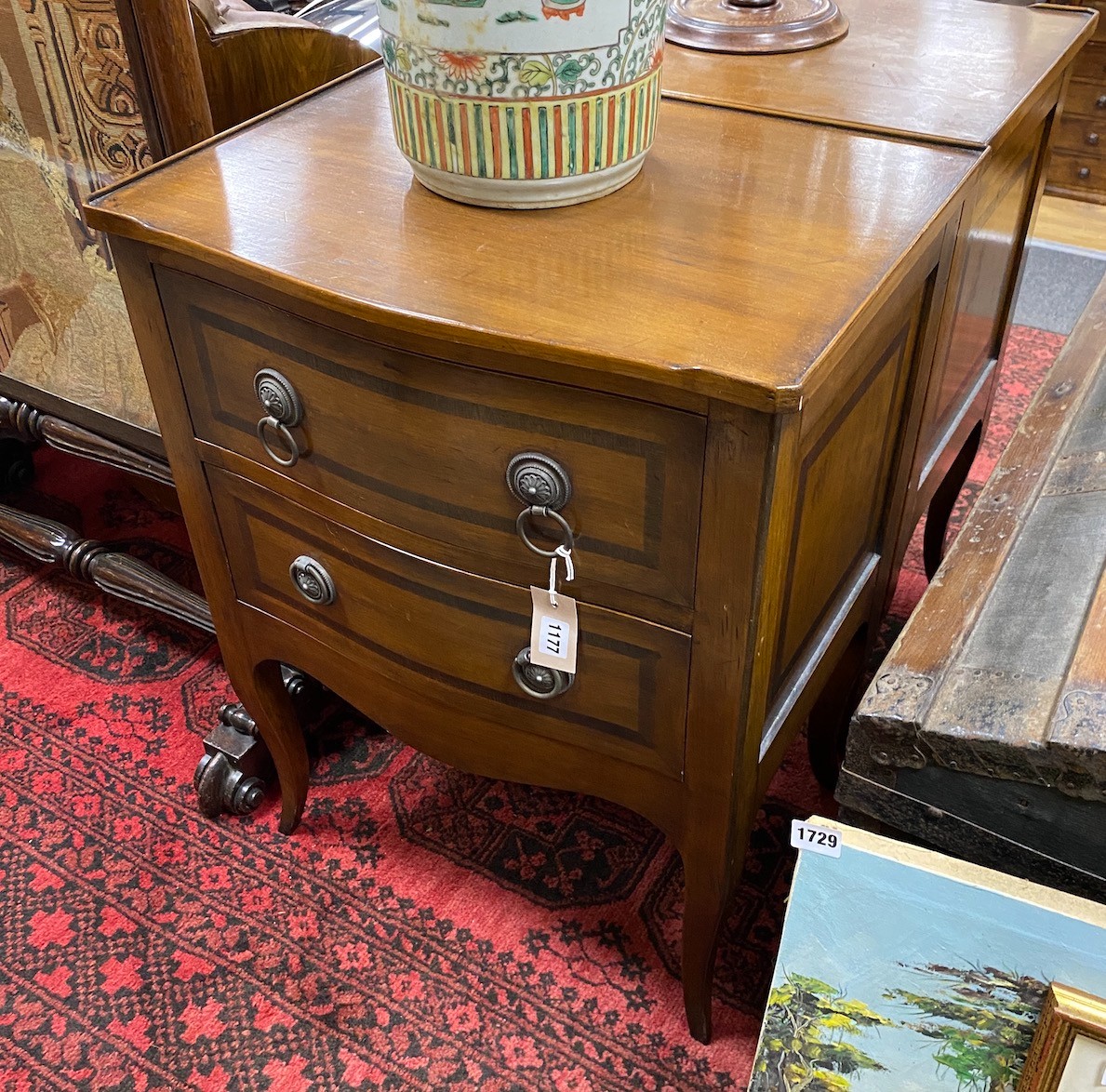 A pair of reproduction serpentine two drawer mahogany bedside chests, width 56cm, depth 41cm, height 72cm